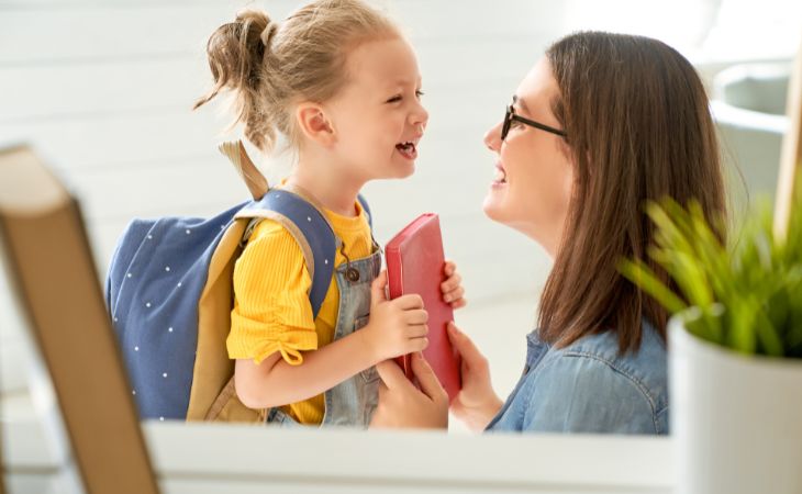 How to spend the day having fun with the kids: Mom and girl smiling at each other