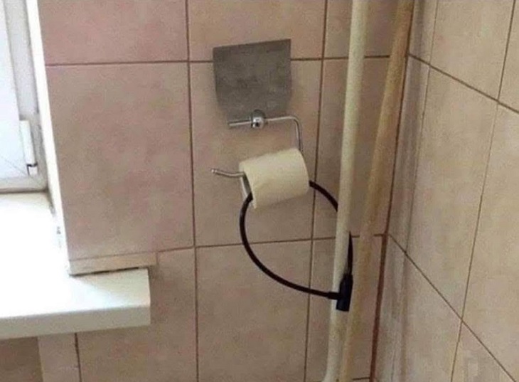 Failed designs and funny signs: Toilet paper secured with a bike lock to a pole