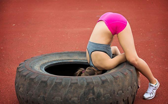 Trivia Women influence history: a woman with head in a tire