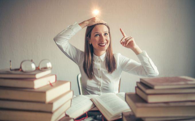 Transportation Test: A woman surrounded by books with a light -lit light