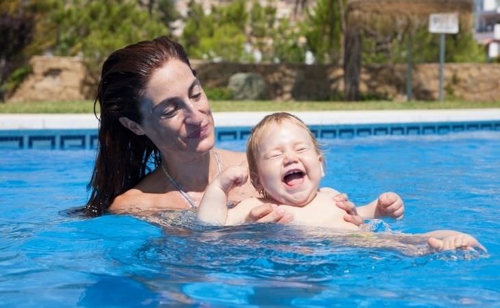 Pool Safety: Woman with Baby in Water