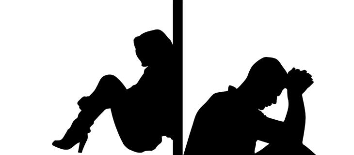 How to deal with overly sensitive partners: Silhouettes of partners on opposite sides of a wall looking dejected
